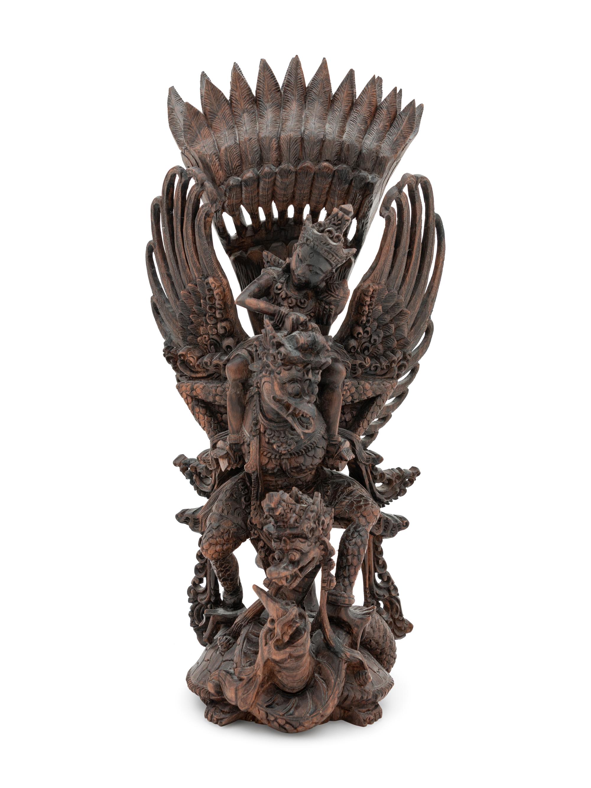 A Thai Carved Wood Figural Group of a Deity and Animals