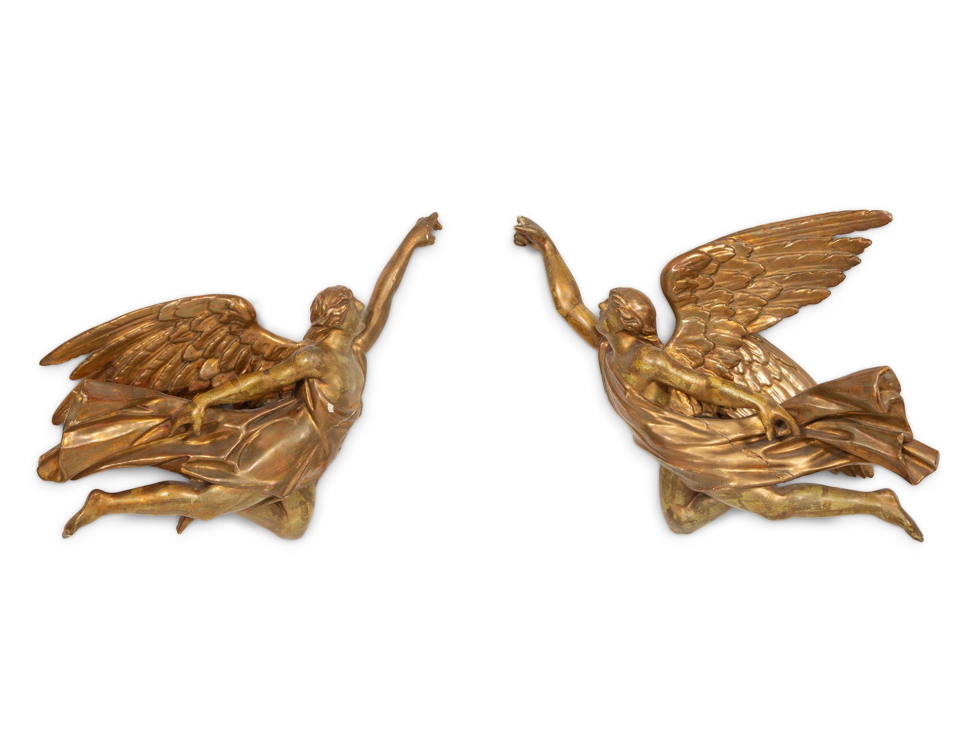 A Pair of Italian Carved Giltwood Winged Angel Appliqués