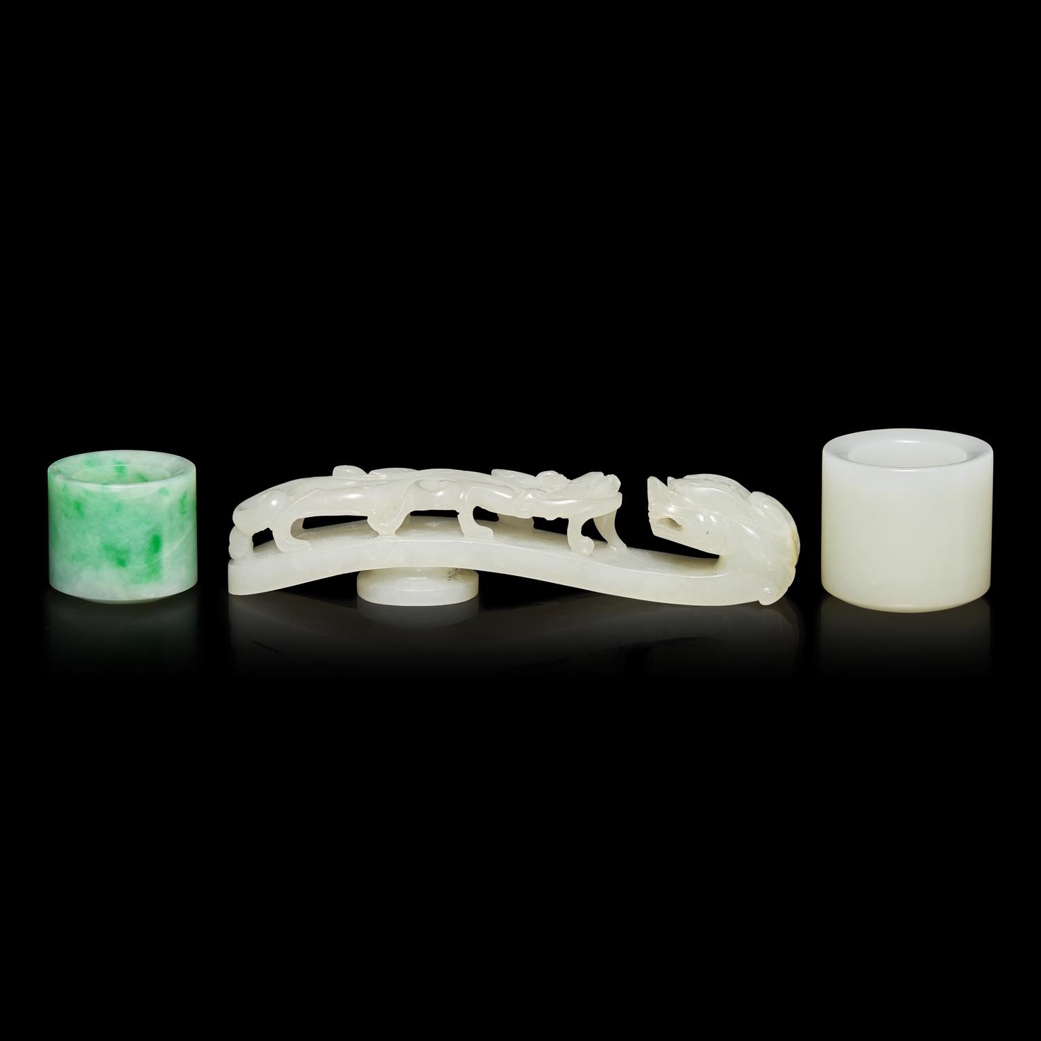 Two Chinese Jade and Jadeite Archer's Rings and a Jade 'Dragon' Belt Hook, Qing Dynasty 清 白玉、翡翠扳指及龍鈎一組三件