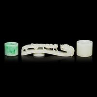 Two Chinese Jade and Jadeite Archer's Rings and a Jade 'Dragon' Belt Hook, Qing Dynasty 清 白玉、翡翠扳指及龍鈎一組三件