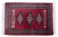 An Oriental Wool Rug 3 feet 1 inch x 2 feet 1 inch.