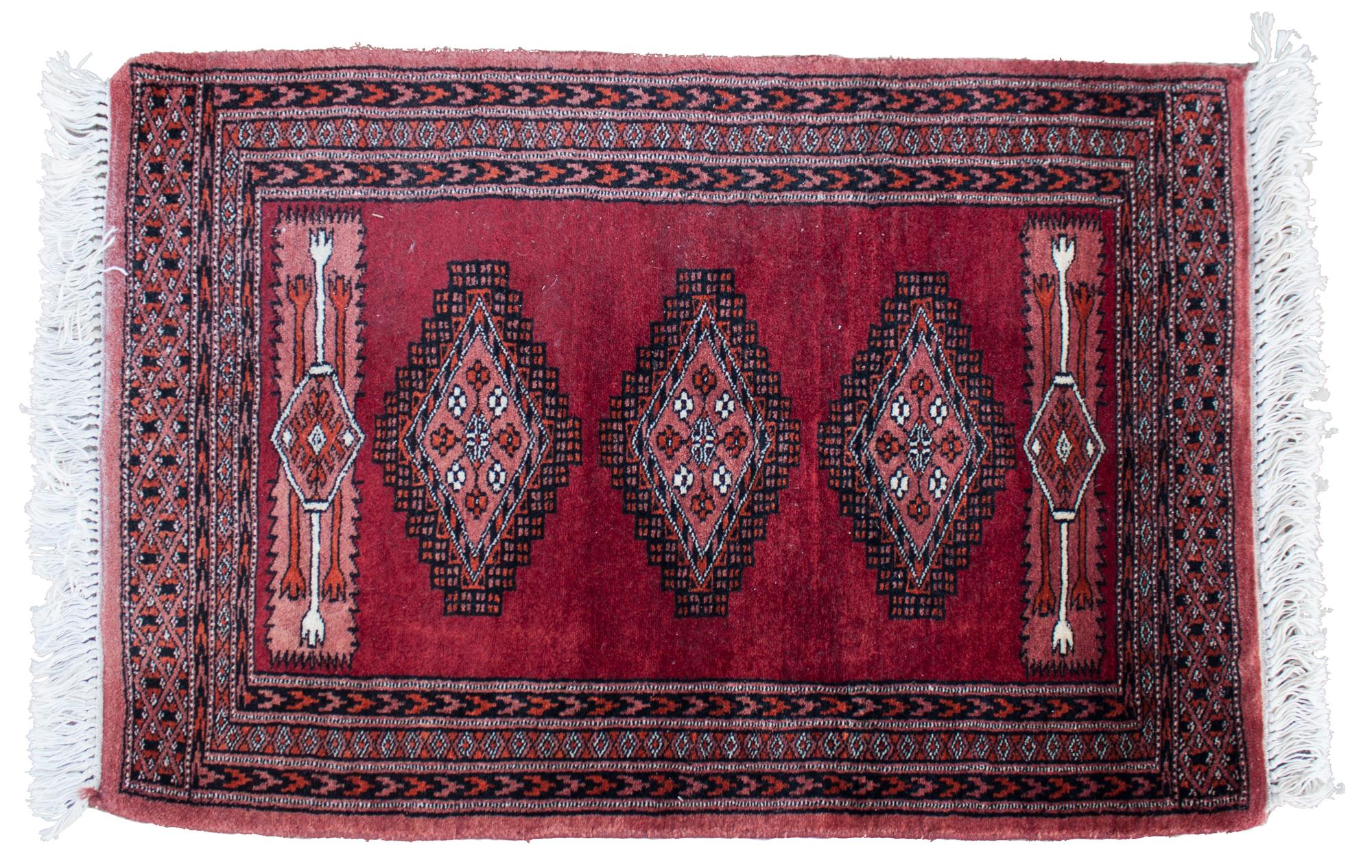 An Oriental Wool Rug 3 feet 1 inch x 2 feet 1 inch.
