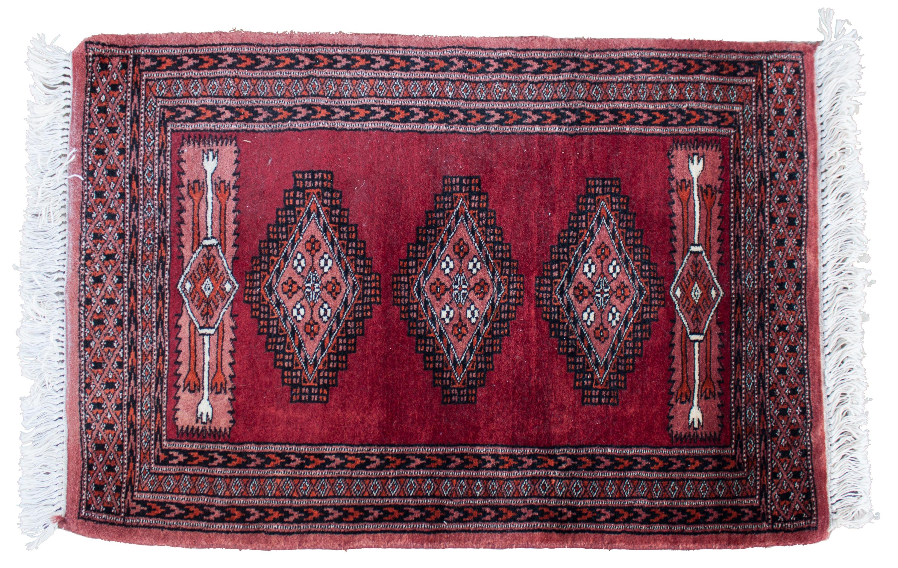 An Oriental Wool Rug 3 feet 1 inch x 2 feet 1 inch.
