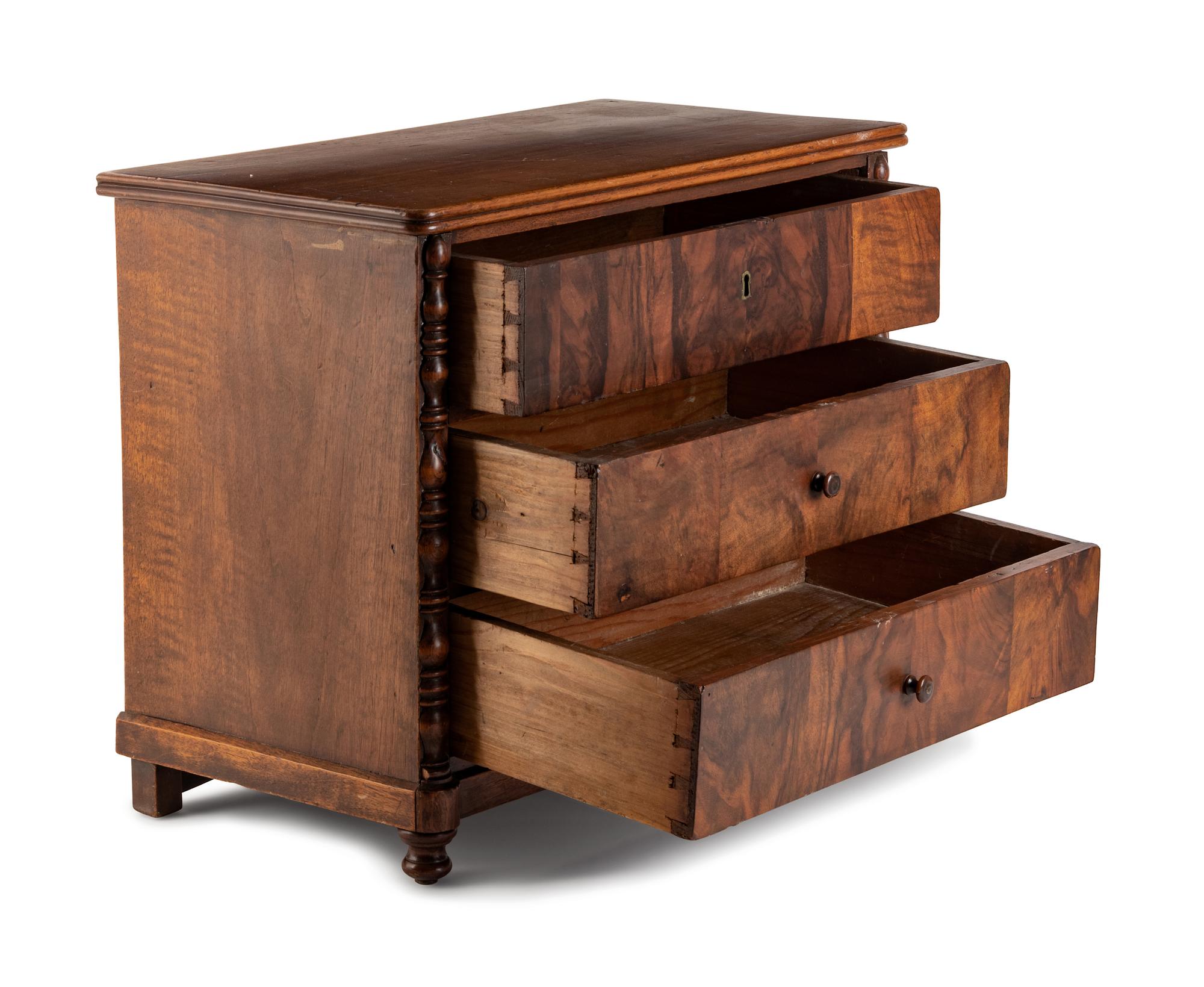 An English Diminutive Walnut Chest of Drawers