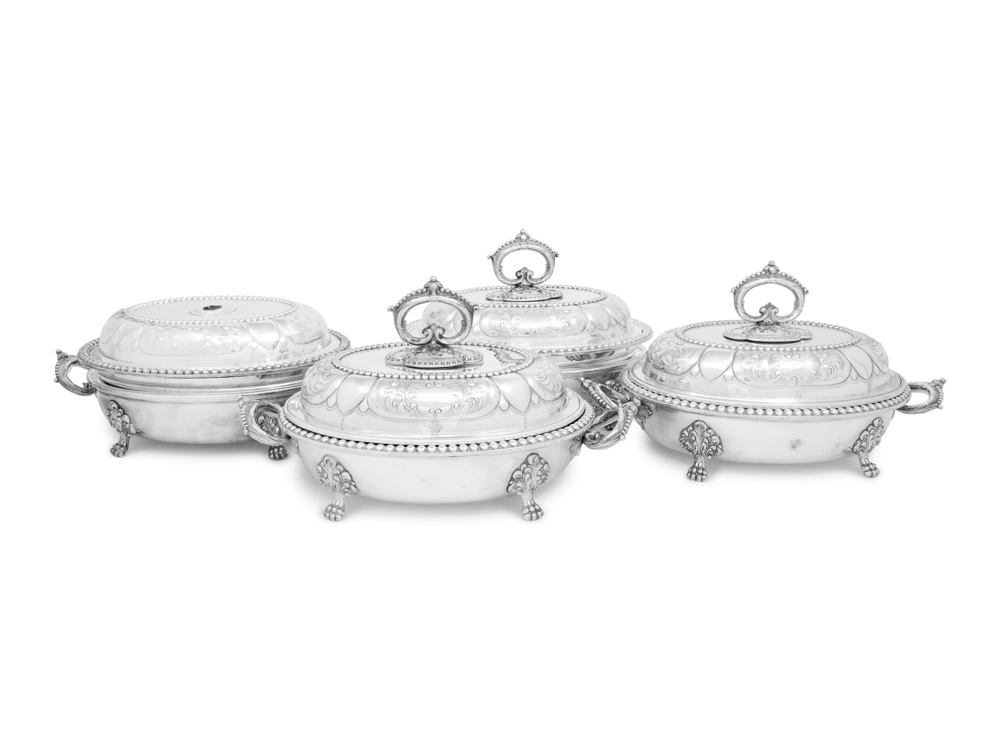 A Set of Four Victorian Silver-Plate Oval Vegetable Dishes with Covers and Liners