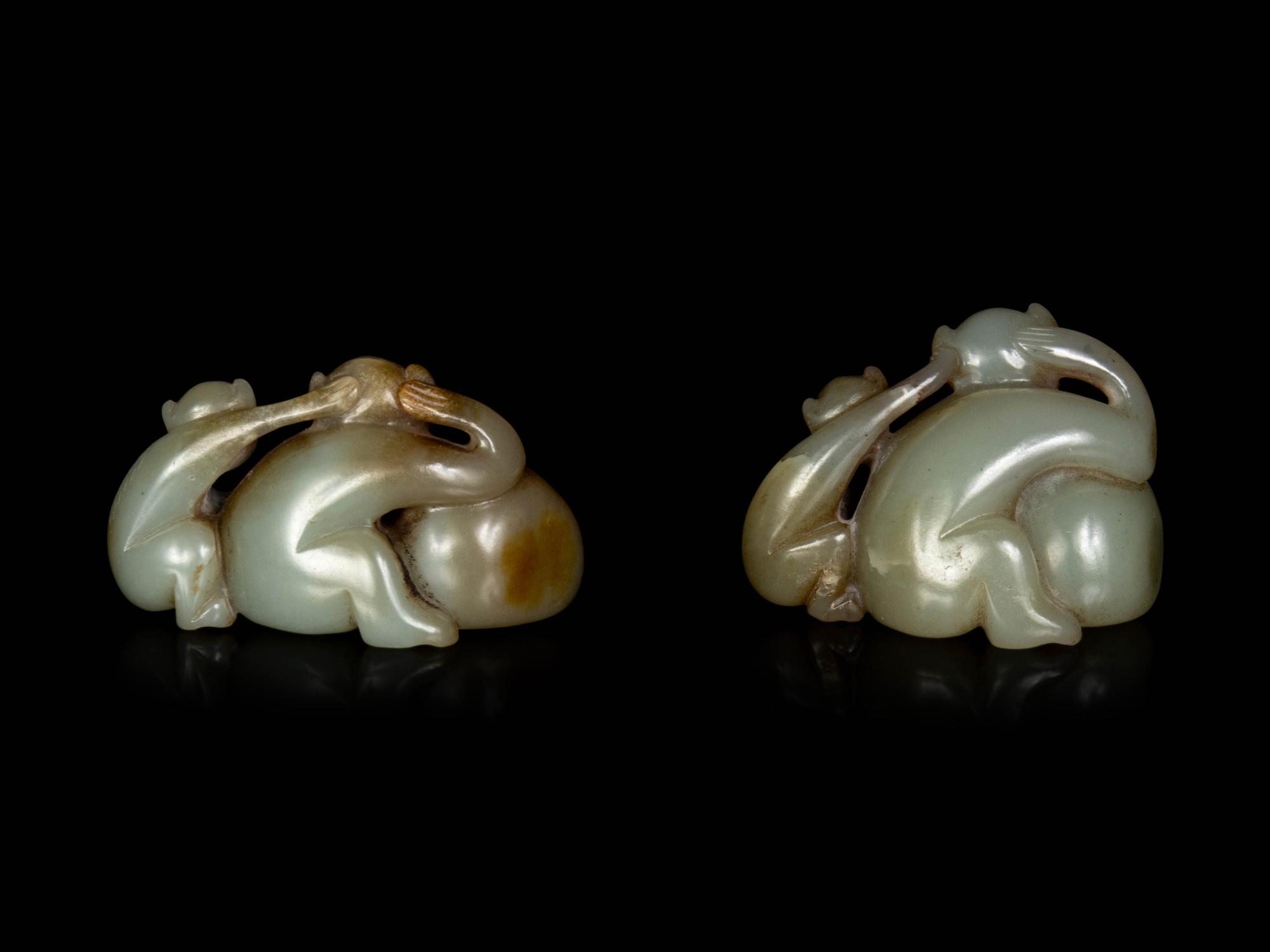 Two Chinese Celadon and Russet Jade Carved Figures of Monkeys