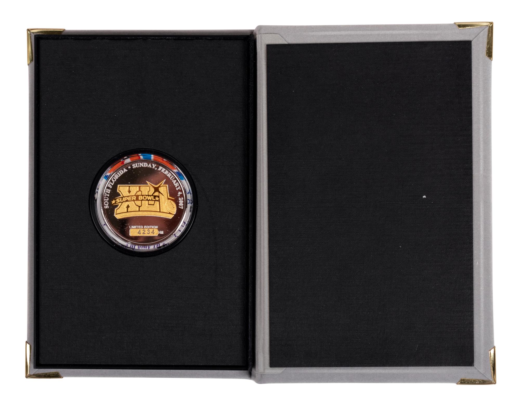 (Sports) A group of football, Super Bowl, and soccer memorabilia, comprising: