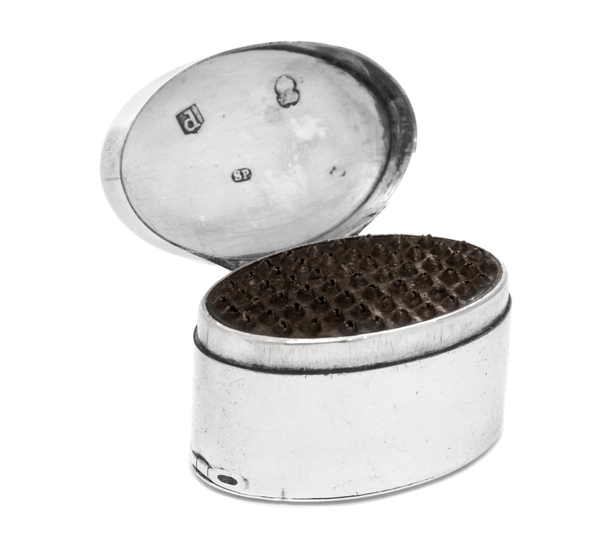 A George III Silver Nutmeg Grater, Samuel Pemberton, Birmingham, 1801, of oval form, the hinged lid opening to a grater.
