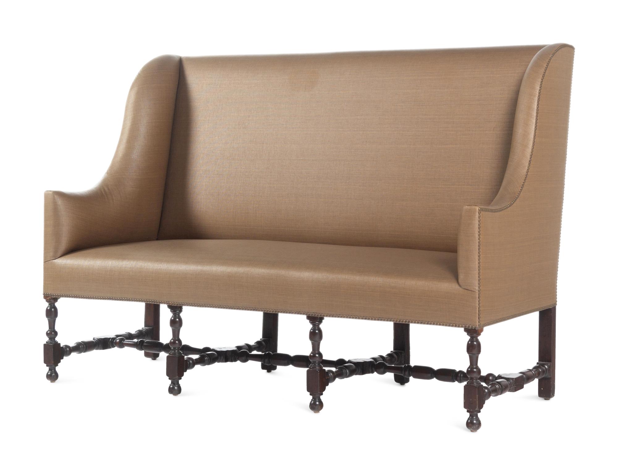 A French Walnut Wingback Sofa
