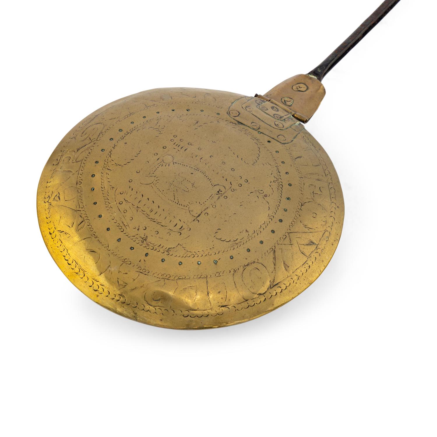A Brass and Iron Bed Warmer