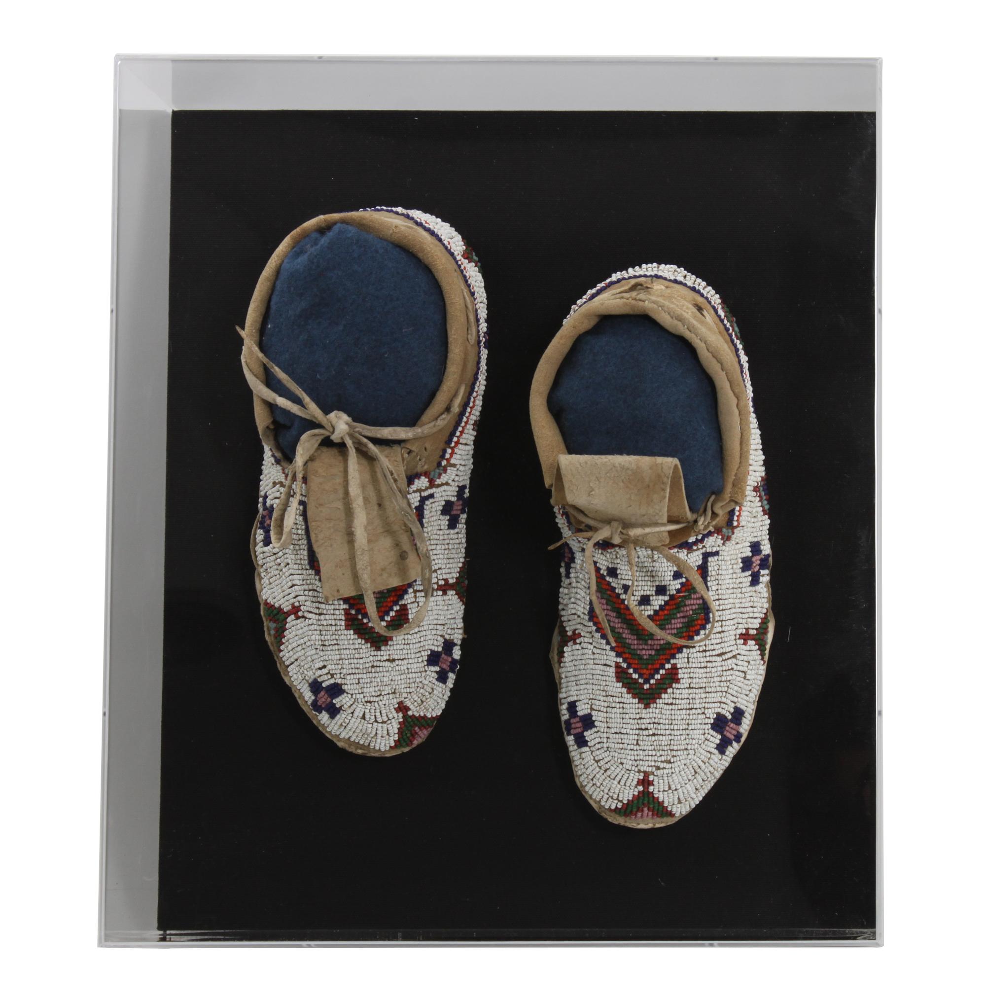 A Pair of Plateau Style Mocassins Length 10 inches — FIRST QUARTER 20TH CENTURY