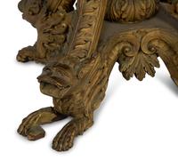 An Anglo-Indian Carved and Parcel Gilt Tilt-Top Table with Lion Form Feet