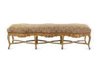 A Louis XV Style Carved Giltwood Serpentine Window Bench