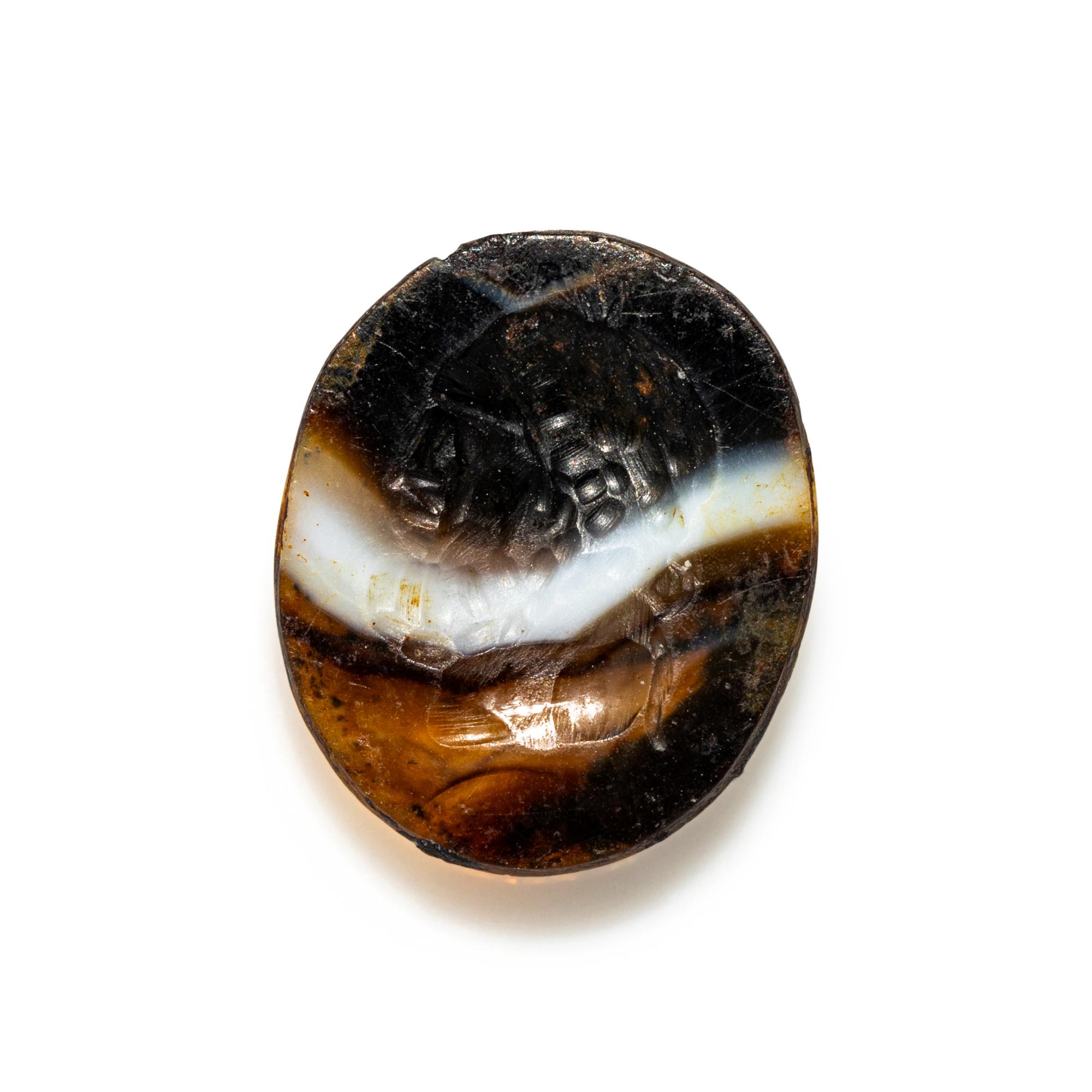 A Roman Banded Agate Ring Stone with the Portrait Head of a Bearded Hercules