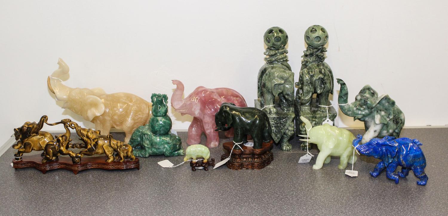 A Group of Eleven Hardstone Elephant Figures Height of tallest 12 inches.