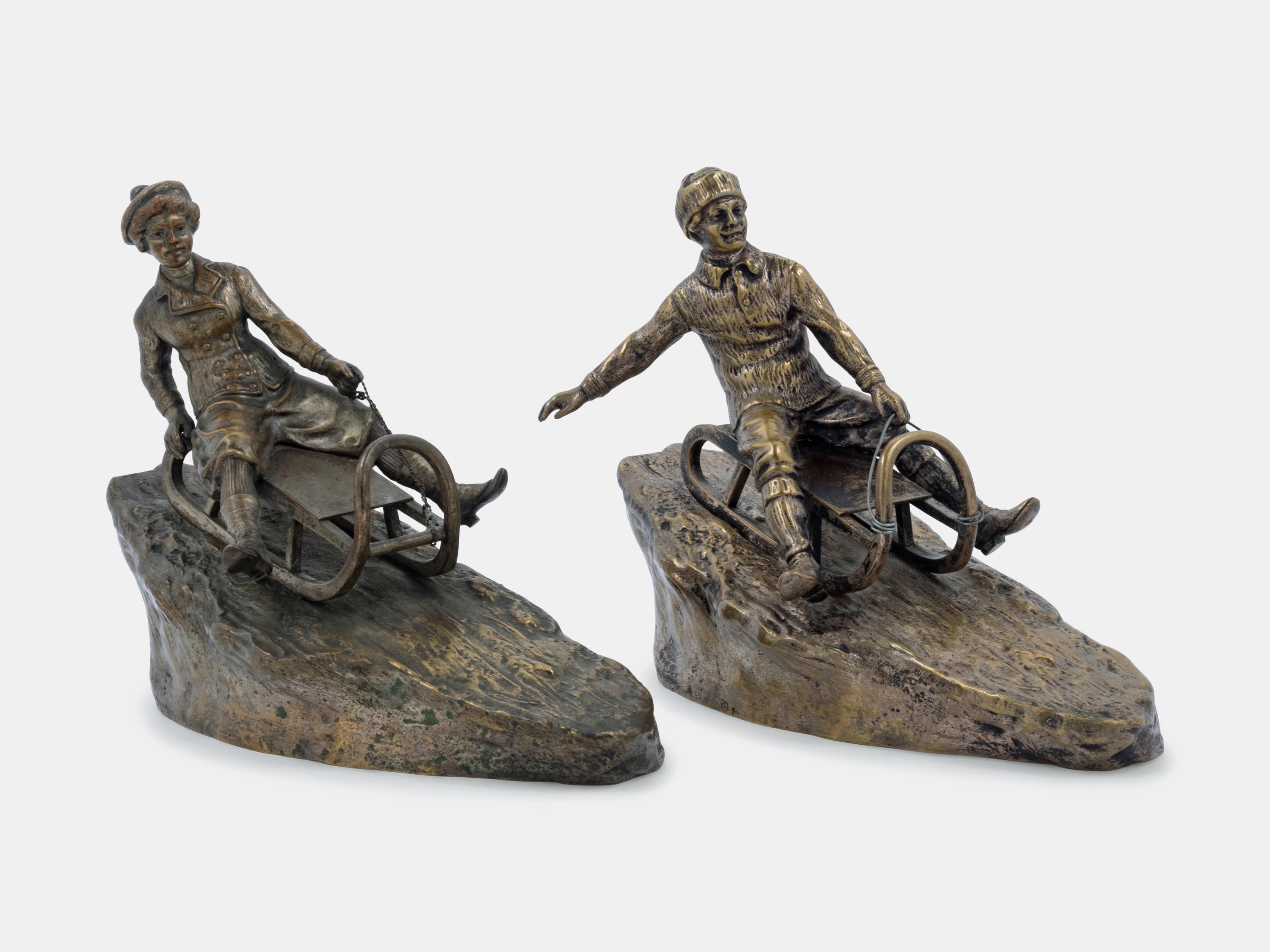 Two Figural Sculptures on Sleds Argentor, Vienna