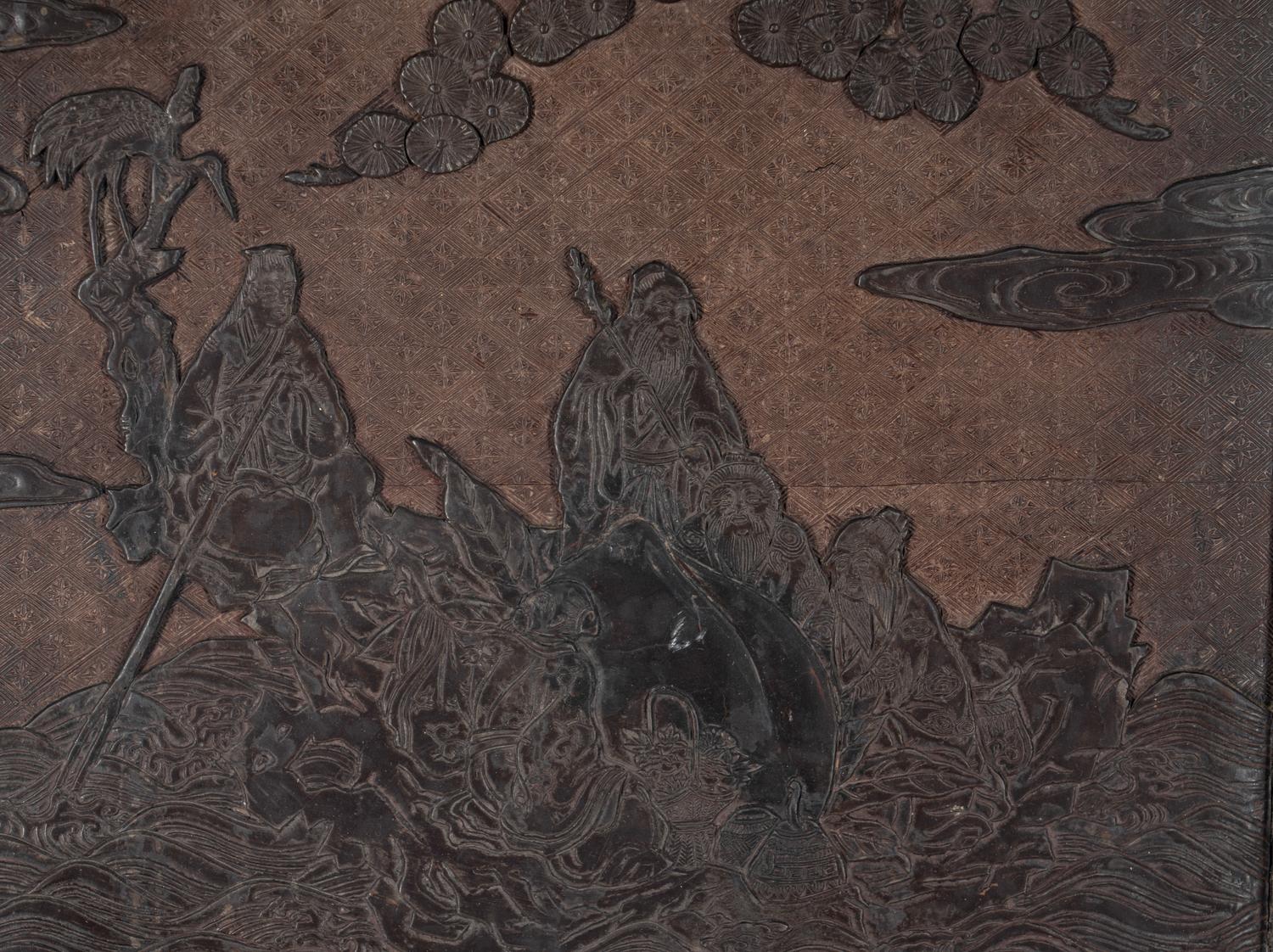A Chinese Carved Lacquer 'Immortals' Wall Panel
