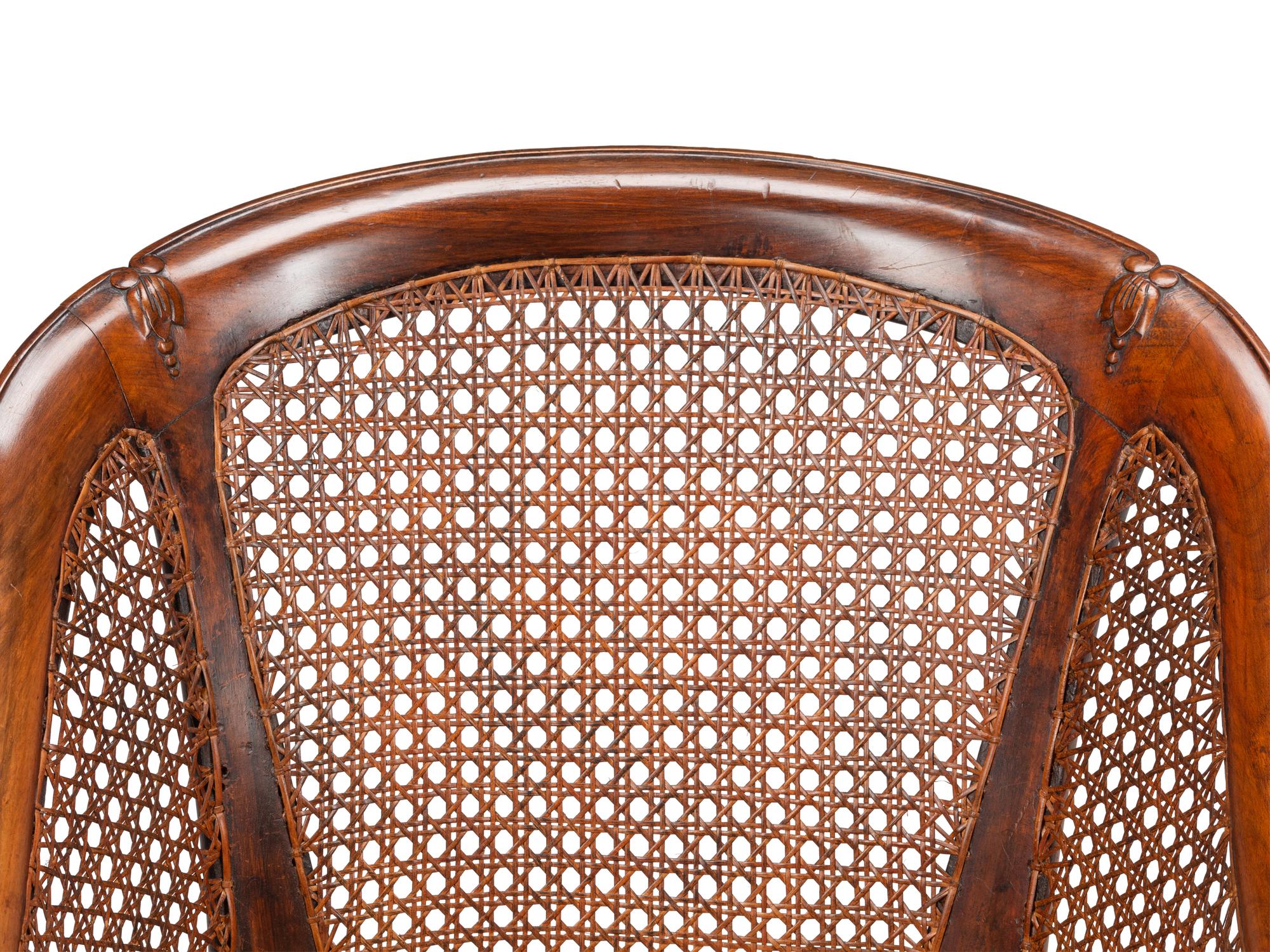 A Pair of English Walnut Barrel-Back Armchairs