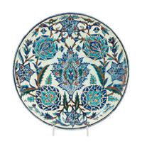 An Islamic Iznik Glazed Pottery Plate and a Small Vase