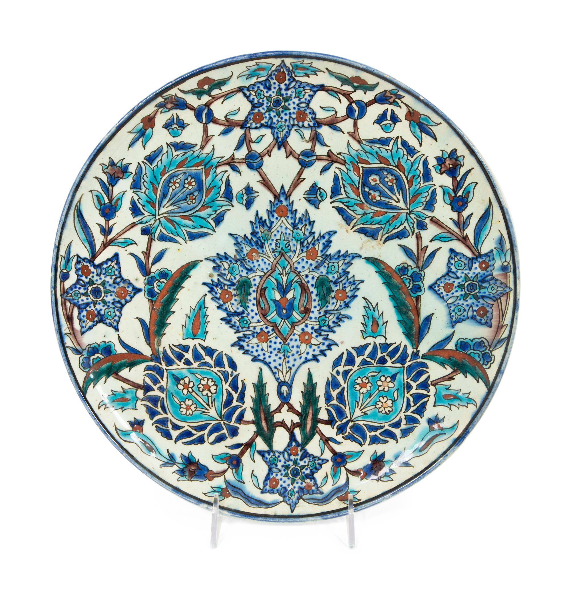 An Islamic Iznik Glazed Pottery Plate and a Small Vase