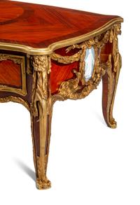 A Louis XV Style Gilt Bronze Mounted Kingwood and Plaque-Inset Bureau Plat