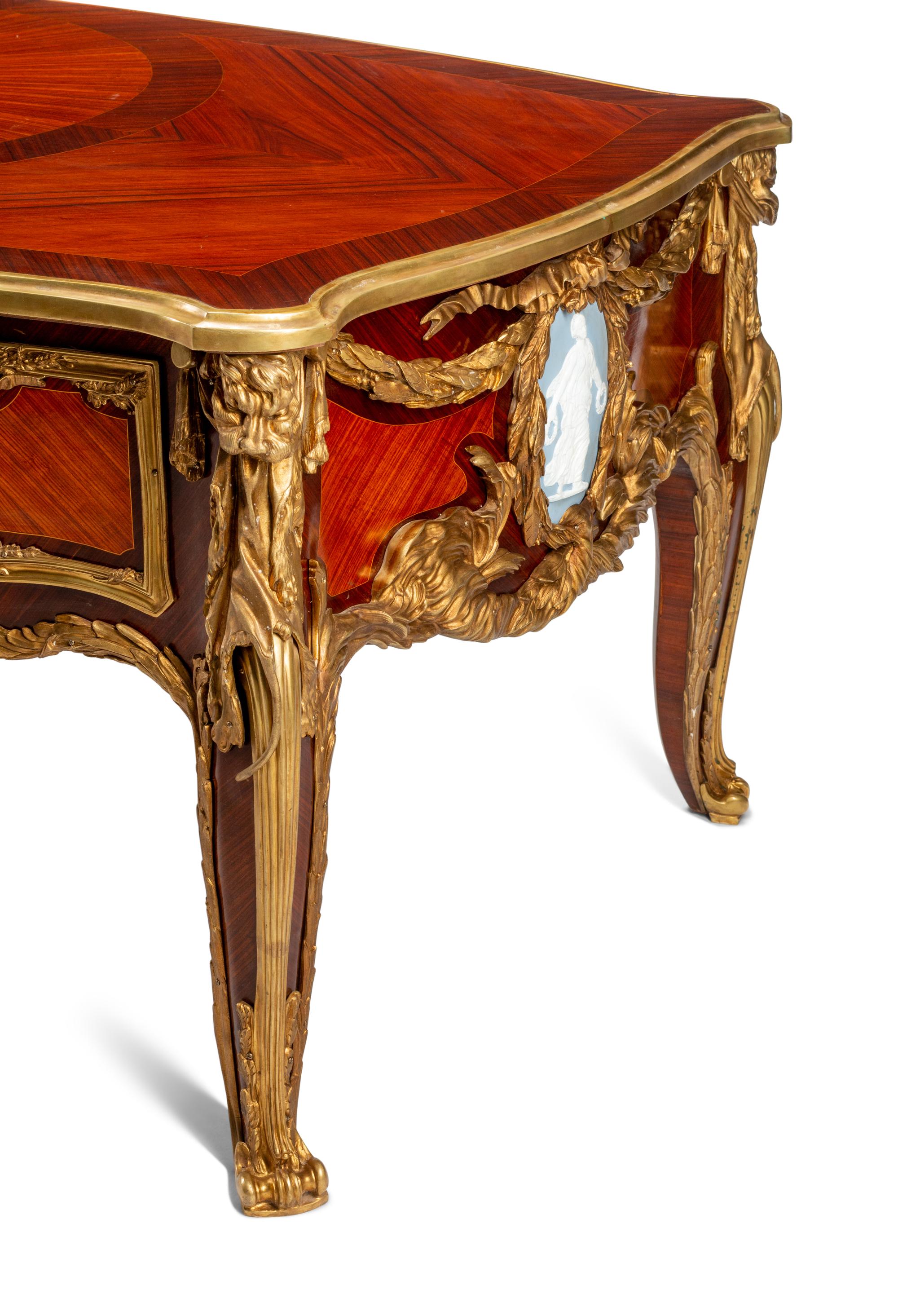 A Louis XV Style Gilt Bronze Mounted Kingwood and Plaque-Inset Bureau Plat