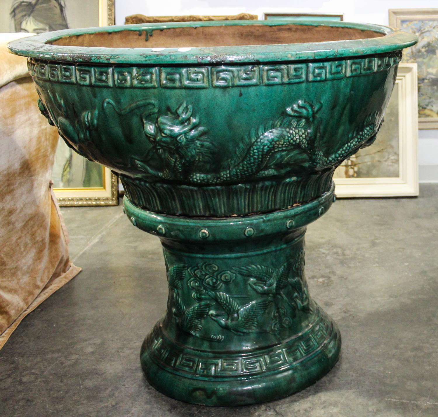 A Pottery Jardiniere. Height 38 inches.