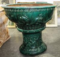 A Pottery Jardiniere. Height 38 inches.