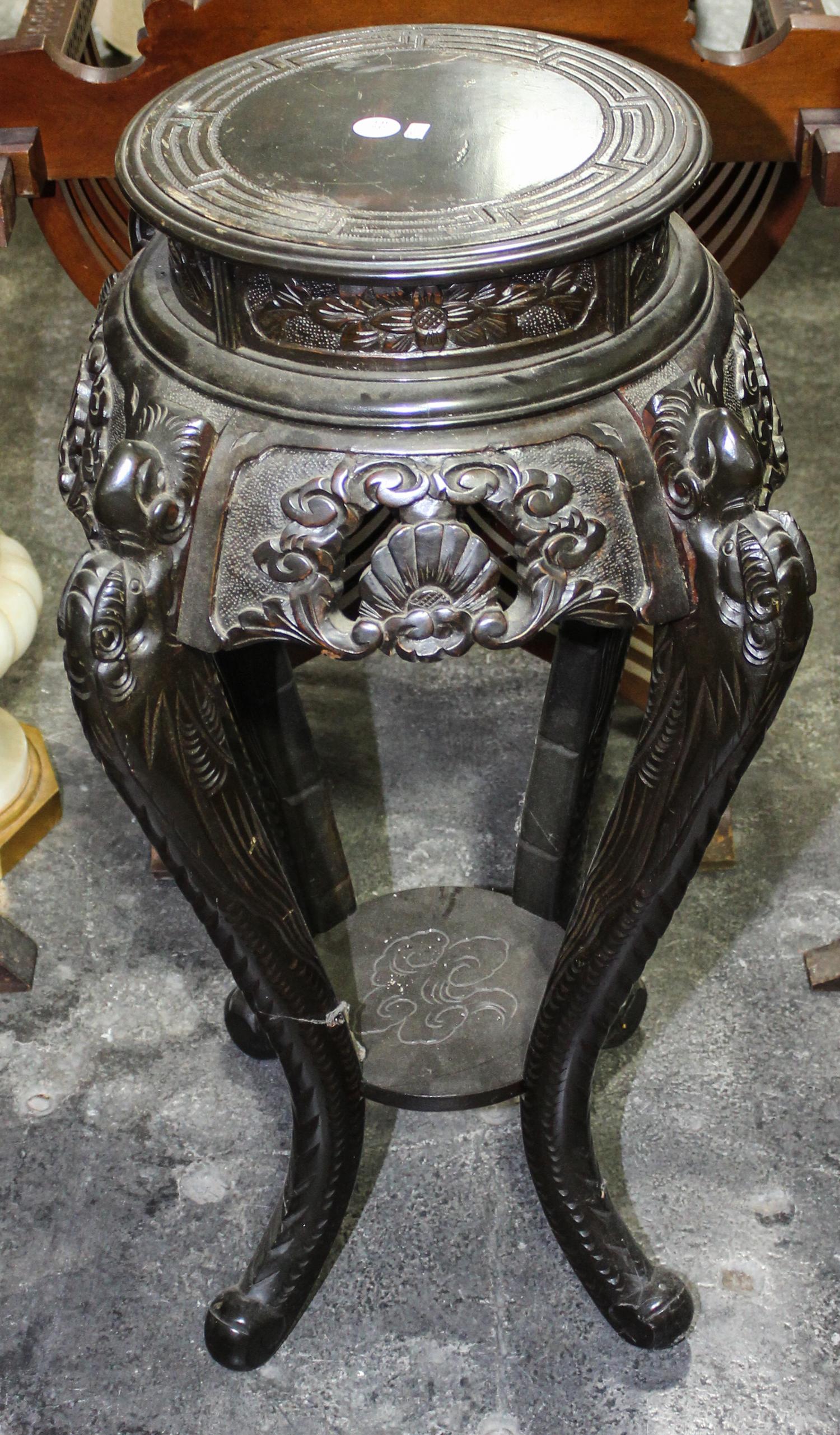 A Chinese Hardwood Pedestal. Height 34 inches.
