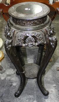 A Chinese Hardwood Pedestal. Height 34 inches.