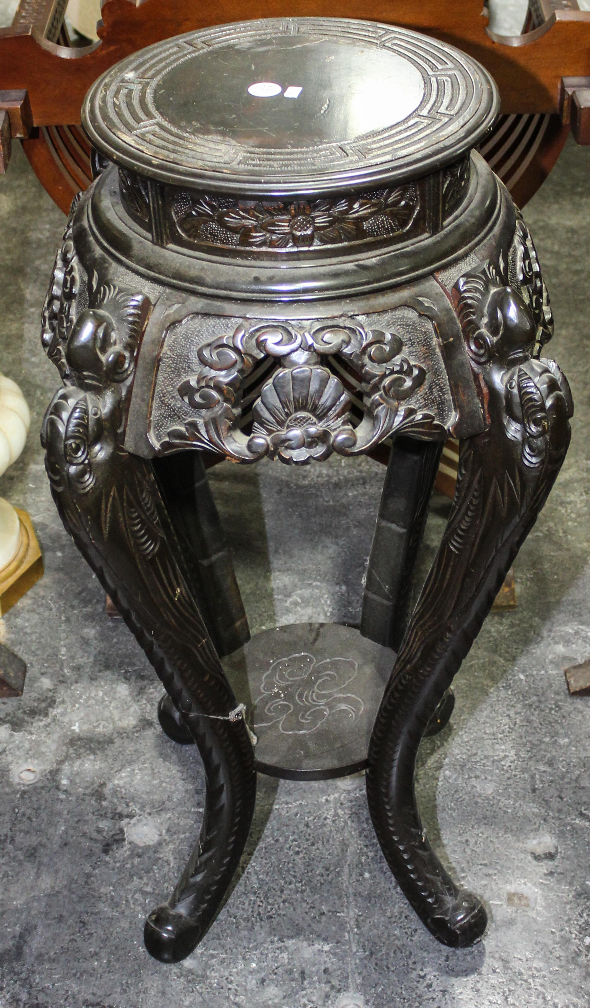 A Chinese Hardwood Pedestal. Height 34 inches.