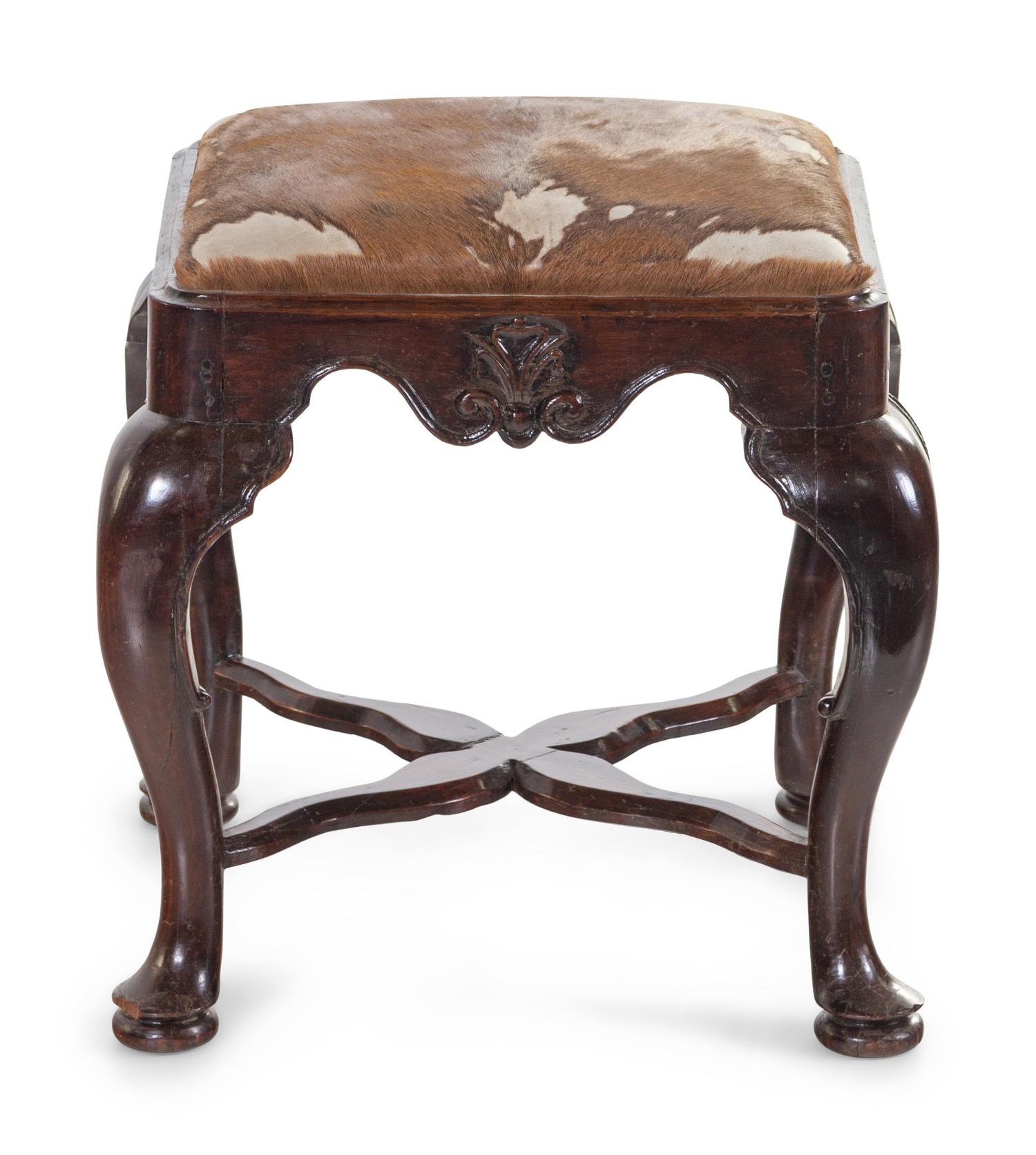 A George II Carved Walnut Footstool with Cowhide Upholstery
