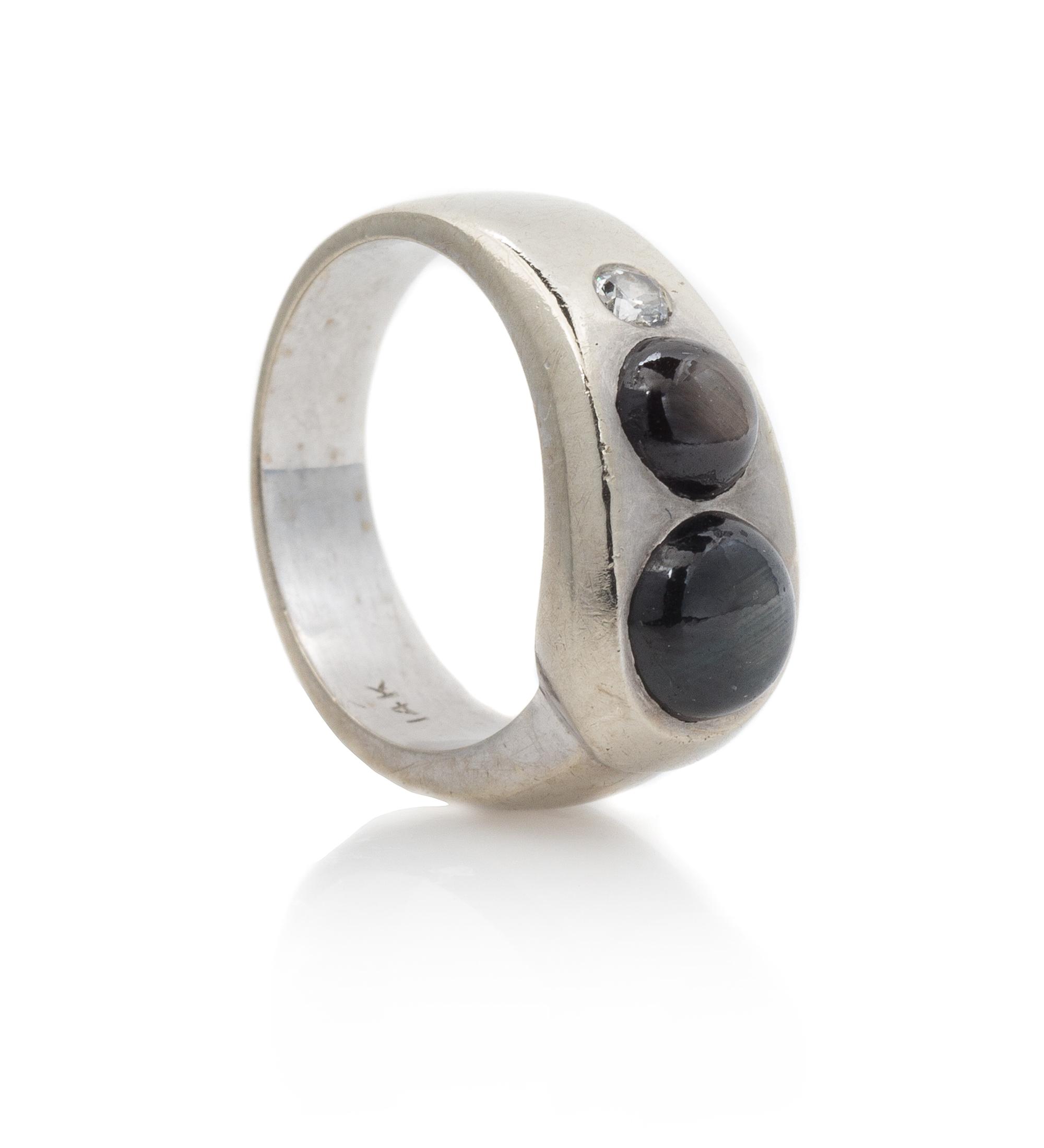 A 14 Karat White Gold, Star Sapphire and Diamond Ring, 5.10 dwts.