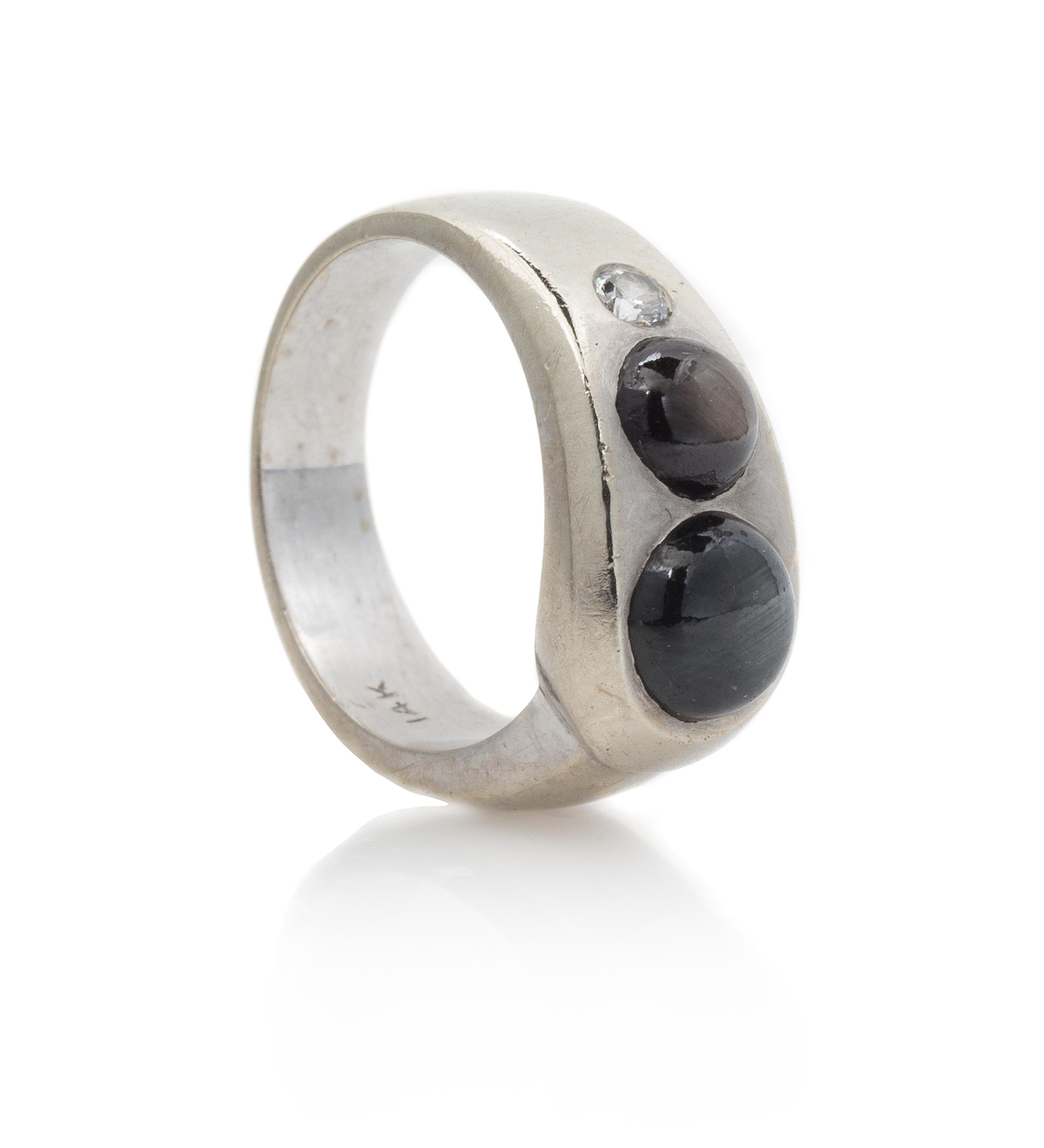 A 14 Karat White Gold, Star Sapphire and Diamond Ring, 5.10 dwts.