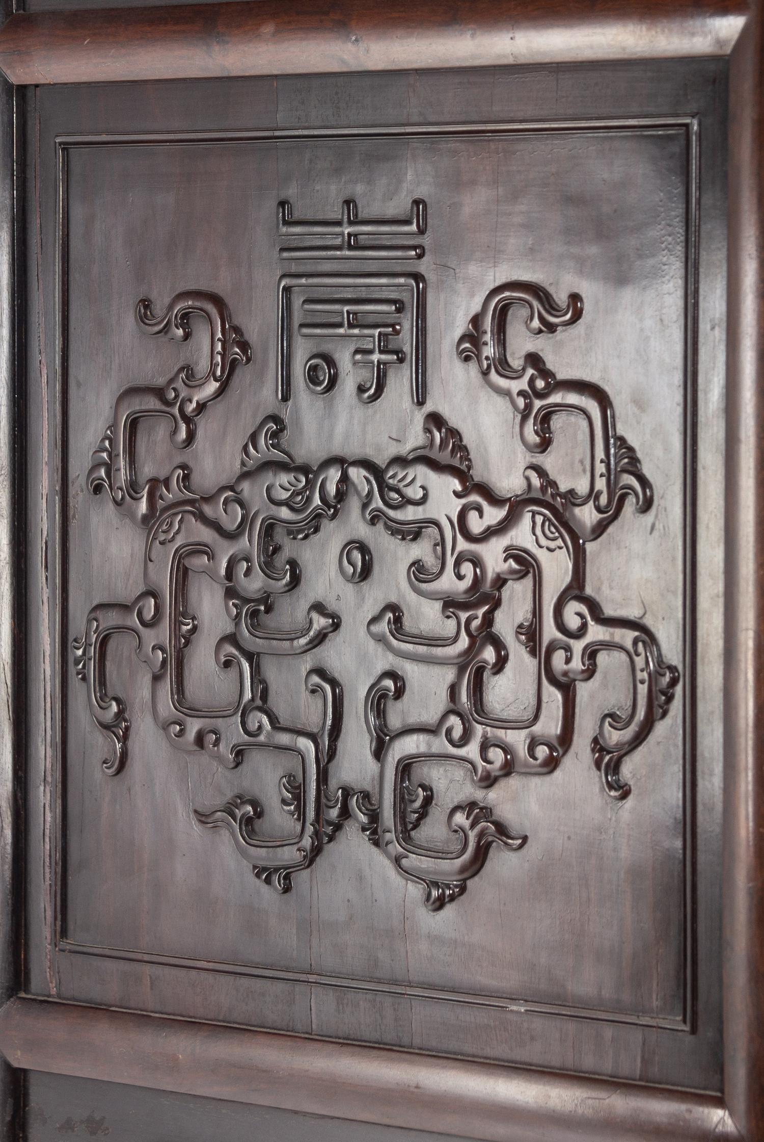 A Pair of Chinese Export Carved Hardwood Cabinets