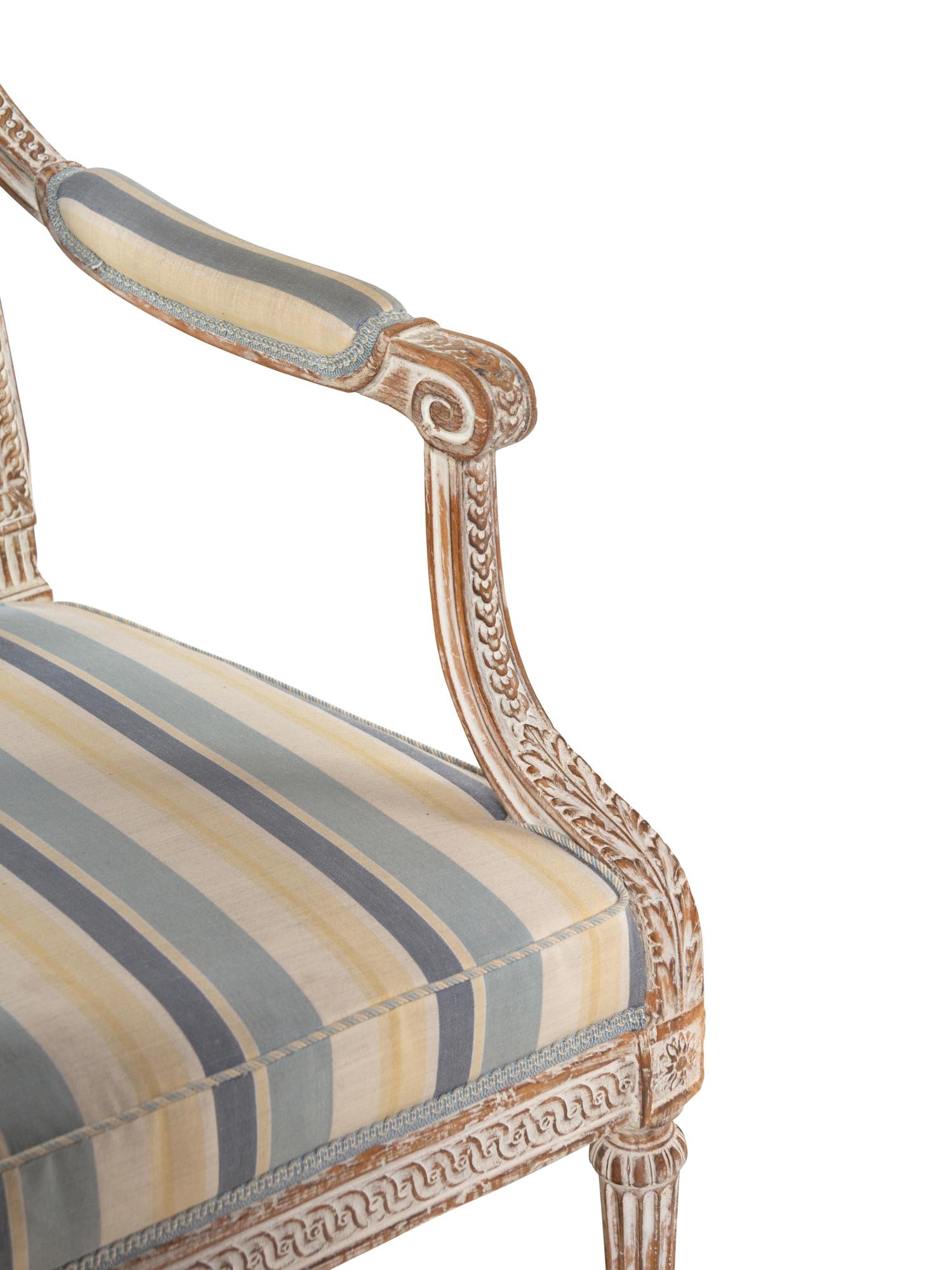 A Pair of Louis XVI Style Cream-Painted Fauteuils
