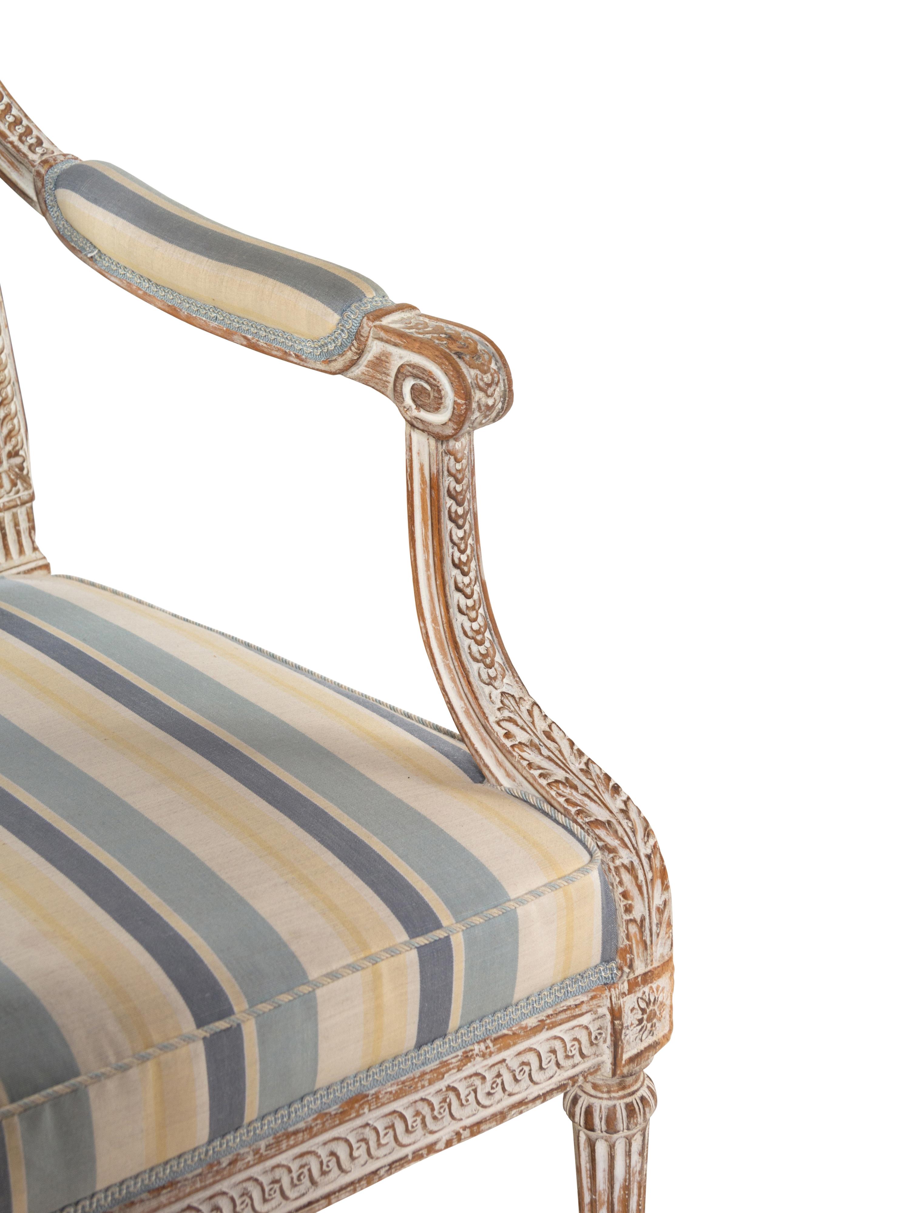 A Pair of Louis XVI Style Cream-Painted Fauteuils