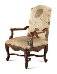 A Pair of Louis XV Style Carved Walnut Fauteuils