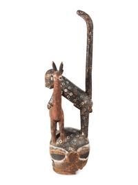 An African Carved and Painted Wood Monkey and Gazelle Figural Group