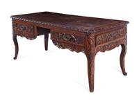 A Louis XV Provincial Style Carved Walnut Desk