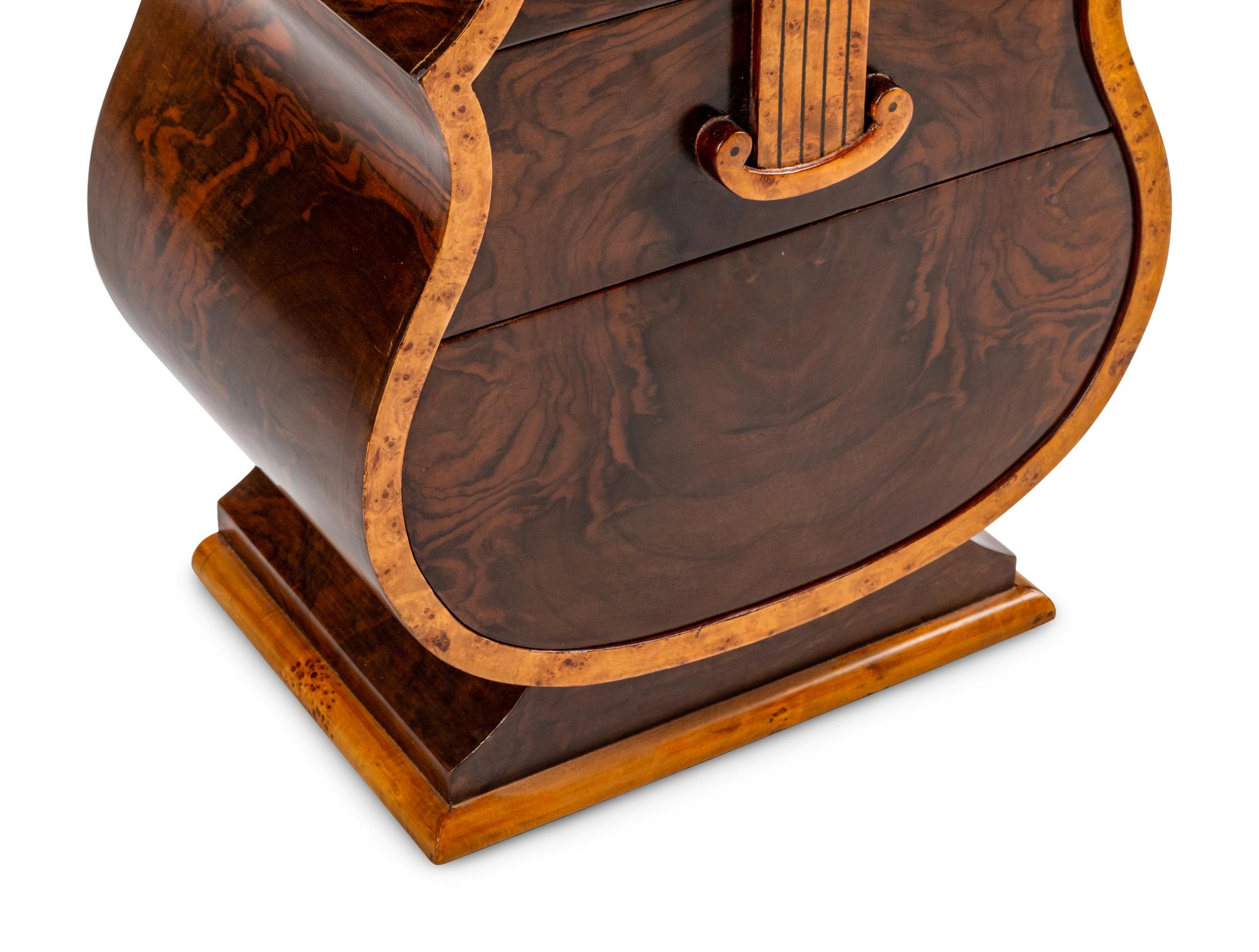 A Continental Burlwood and Walnut “Cello” Cabinet