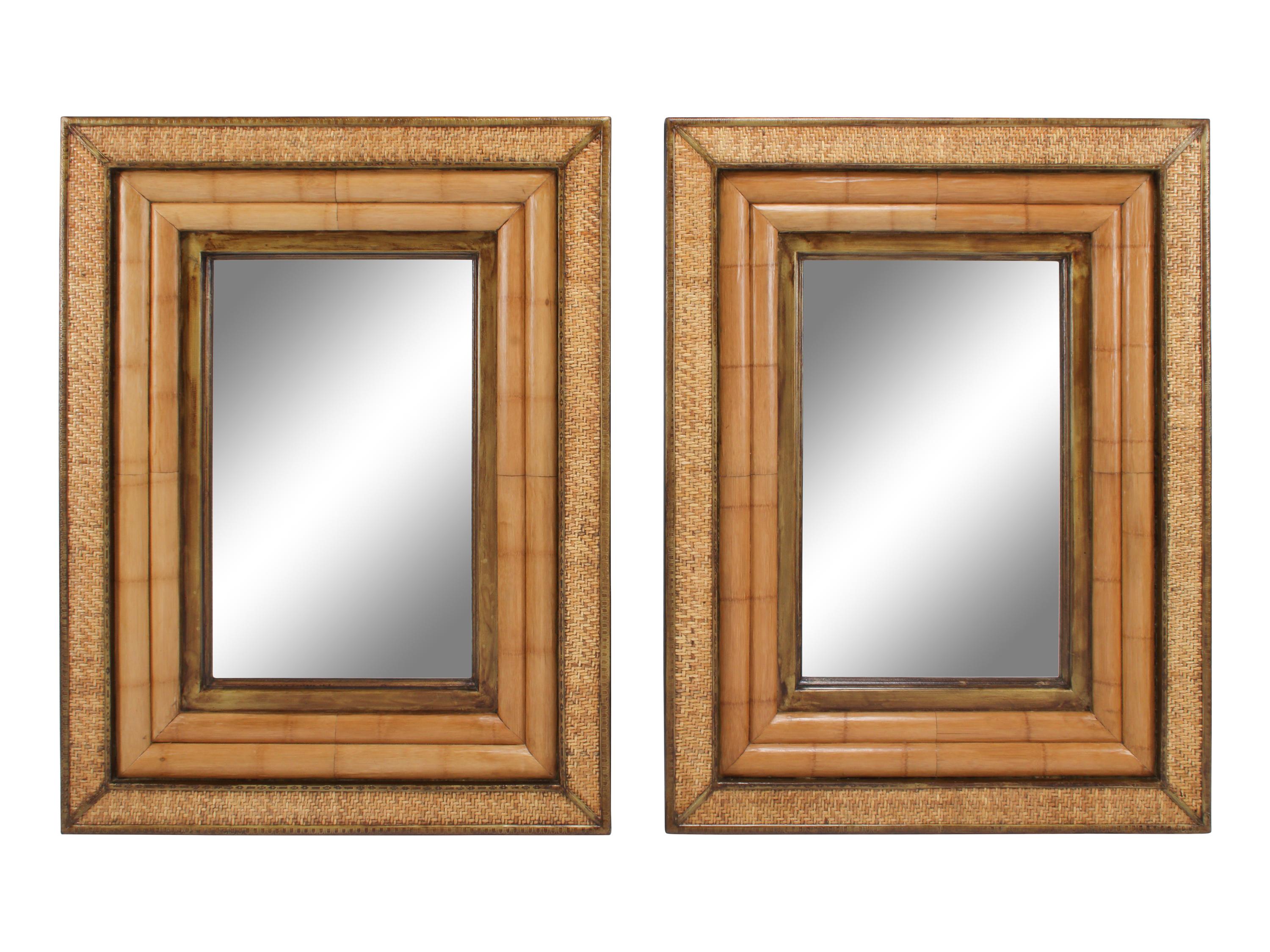 A Pair of Continental Part-Ebonized and Caned Mirrors