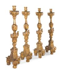 A Set of Four Continental Baroque Style Carved Giltwood Torchères
