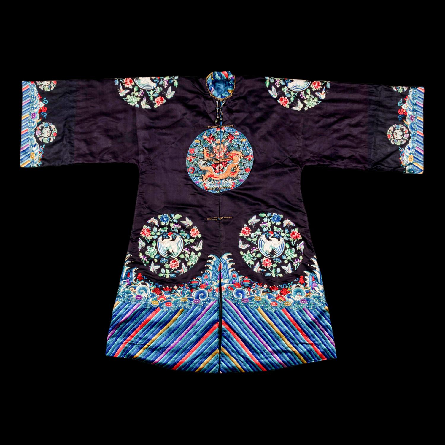 A Chinese Navy Satin Ground Embroidered Silk 'Dragon and Crane' Robe, Qiagua , Late 19th Century 清晚期 石青緞地綉龍紋團鶴紋袷褂