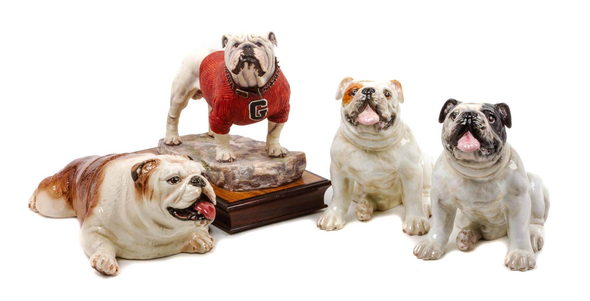 A Group of Four Bulldog Figures Width of widest 12 1/2 inches.