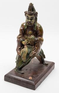 A Sancai Pottery Figural Roof Tile Height 14 inches.