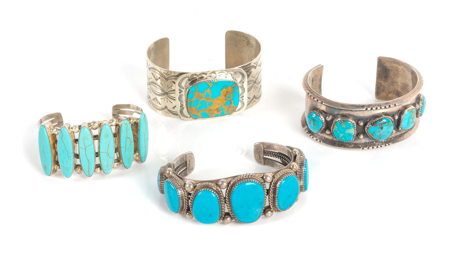 Four Southwestern Silver and Turquoise Cuff Bracelets Length of largest 5 3/4 x opening 1 1/4 x width 1 1/8 inches