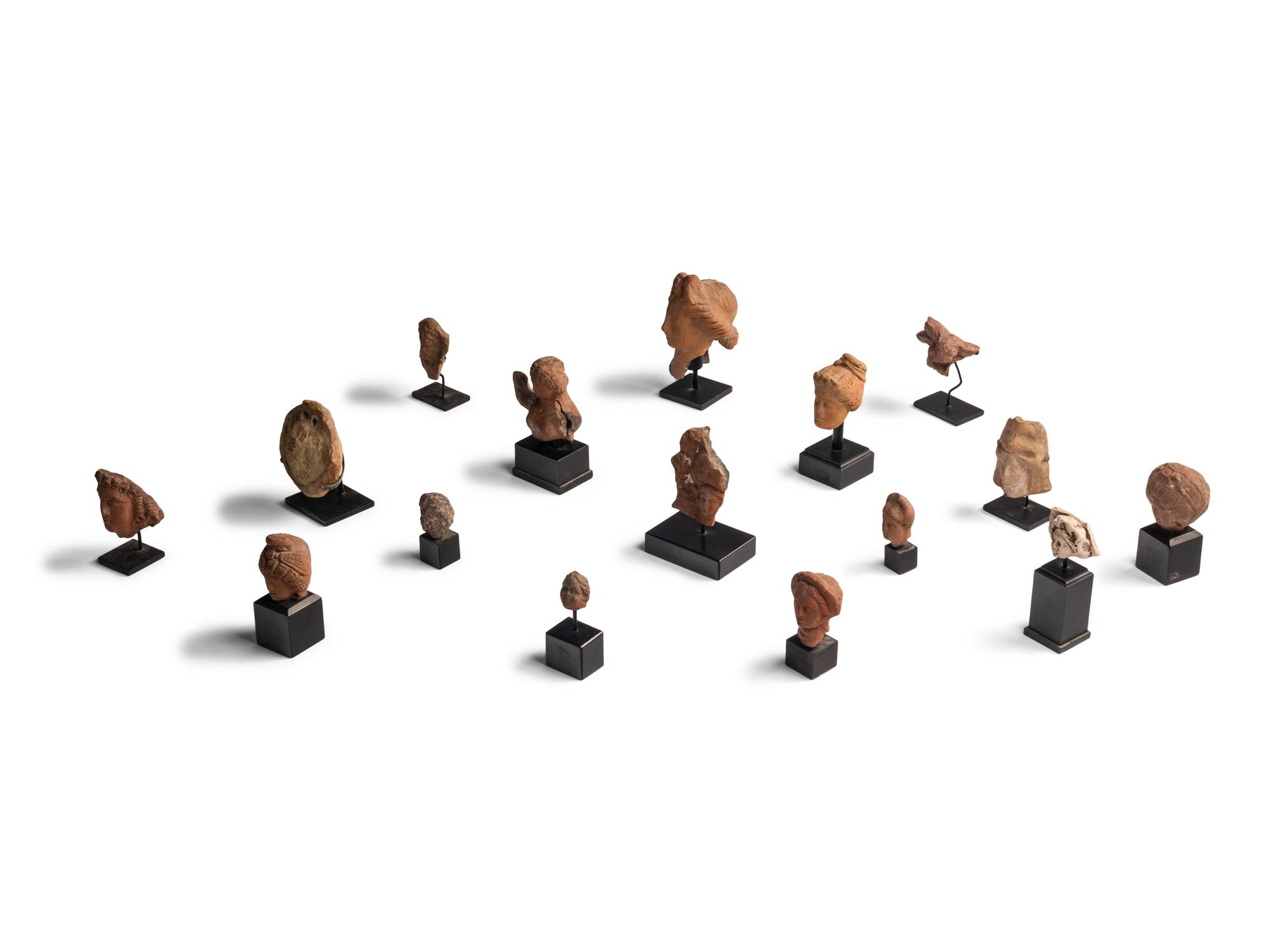 Sixteen Greco-Roman Terracotta Heads and Figures