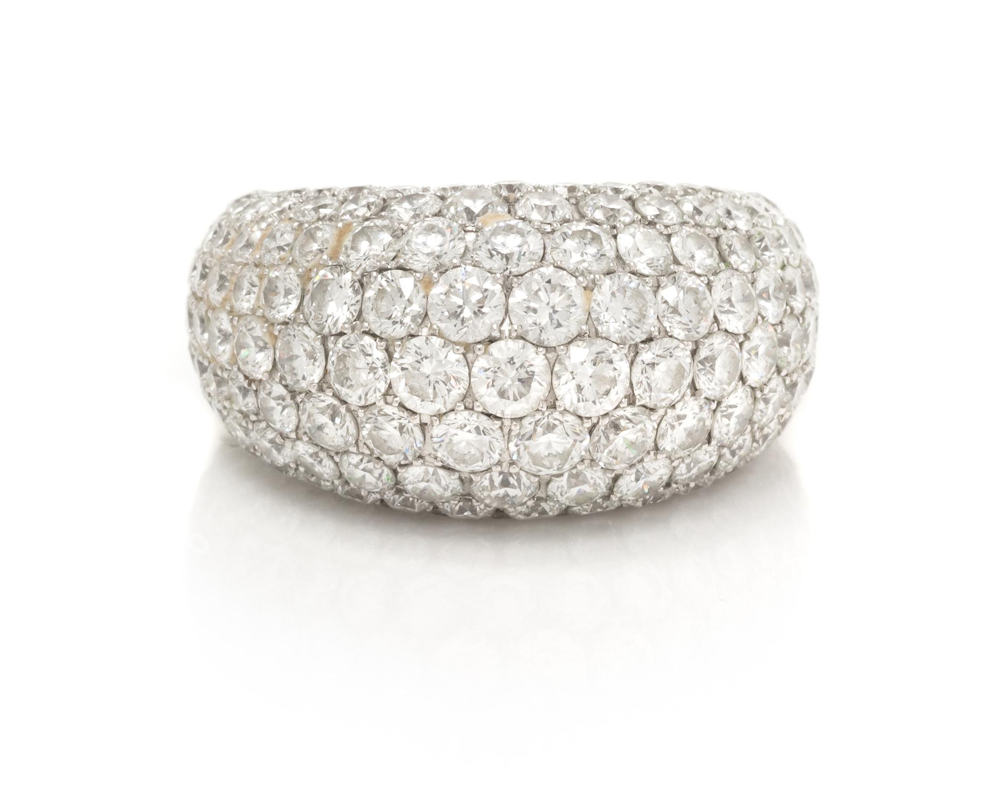 An 18 Karat White Gold and Diamond Band, 8.55 dwts.