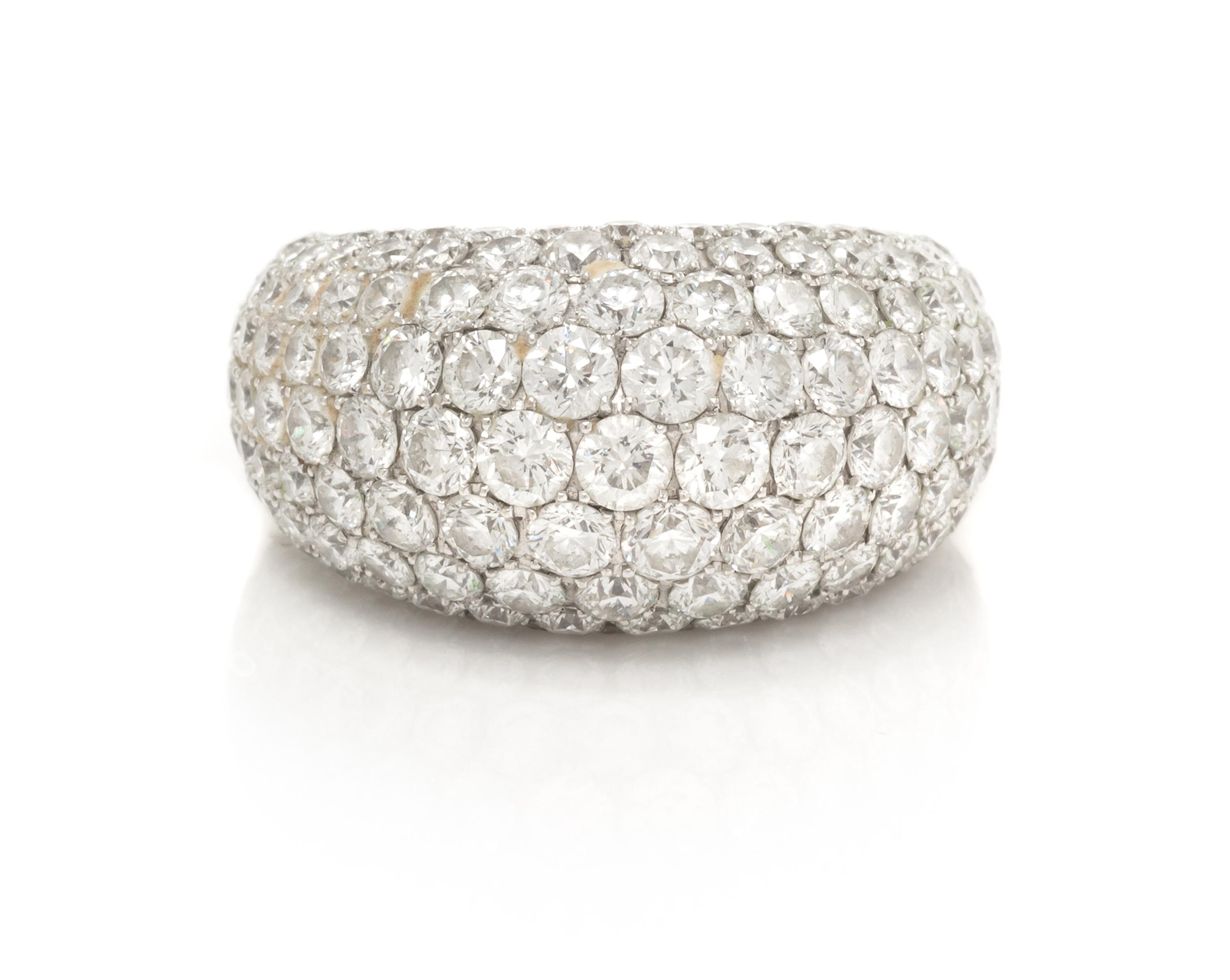 An 18 Karat White Gold and Diamond Band, 8.55 dwts.